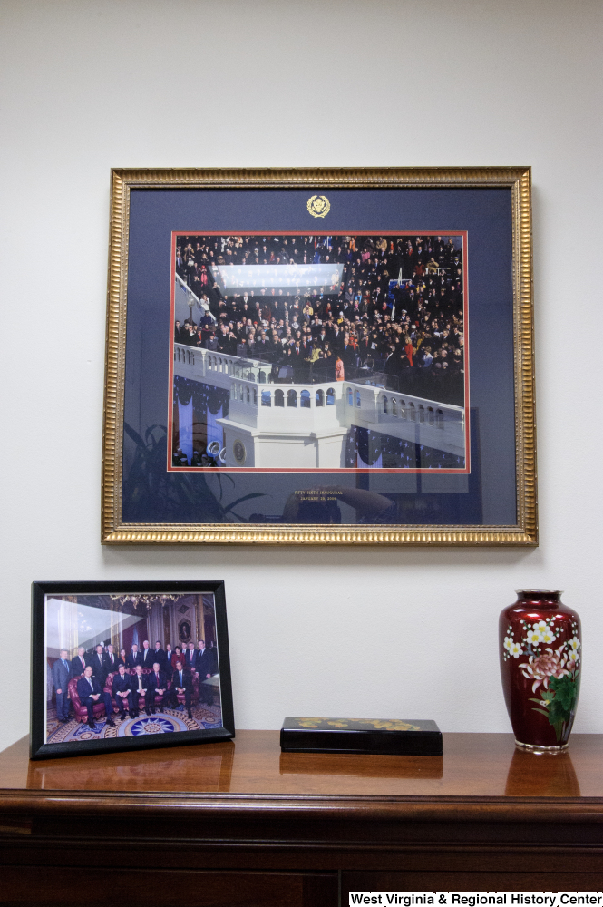 ["A framed photograph of President Obama's first inaugural hangs in the conference room in Senator John D. (Jay) Rockefeller's office."]%