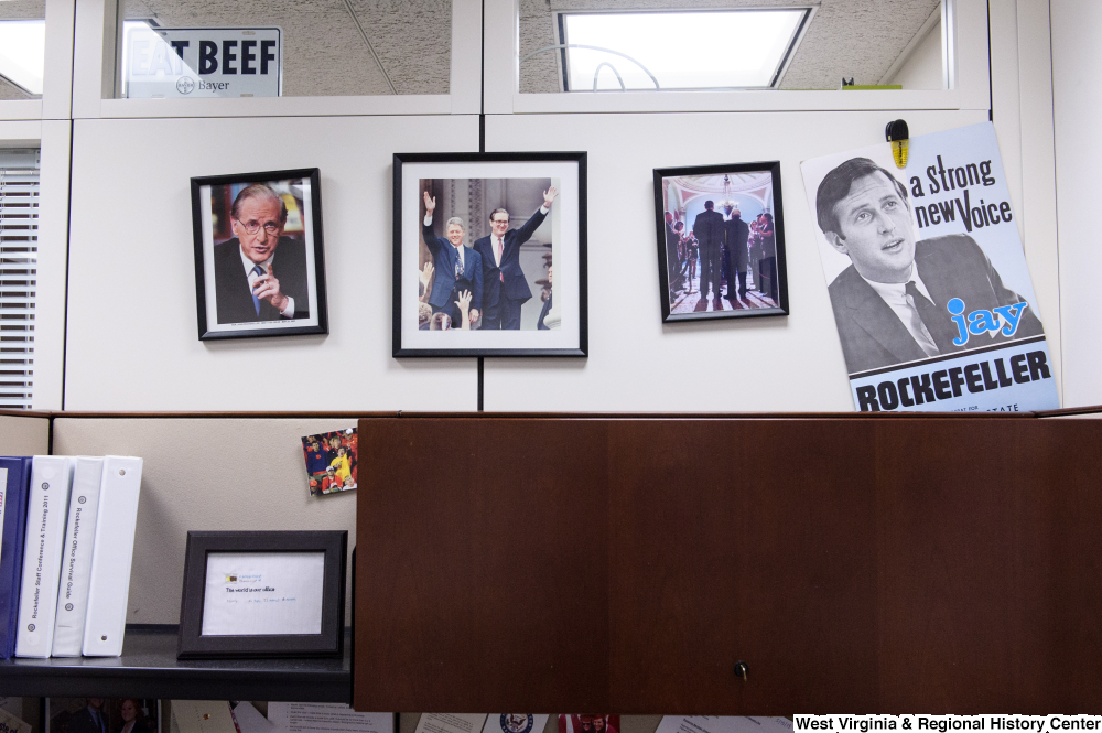 ["Photographs of Senator John D. (Jay) Rockefeller hangs on a wall in the press area of his office."]%