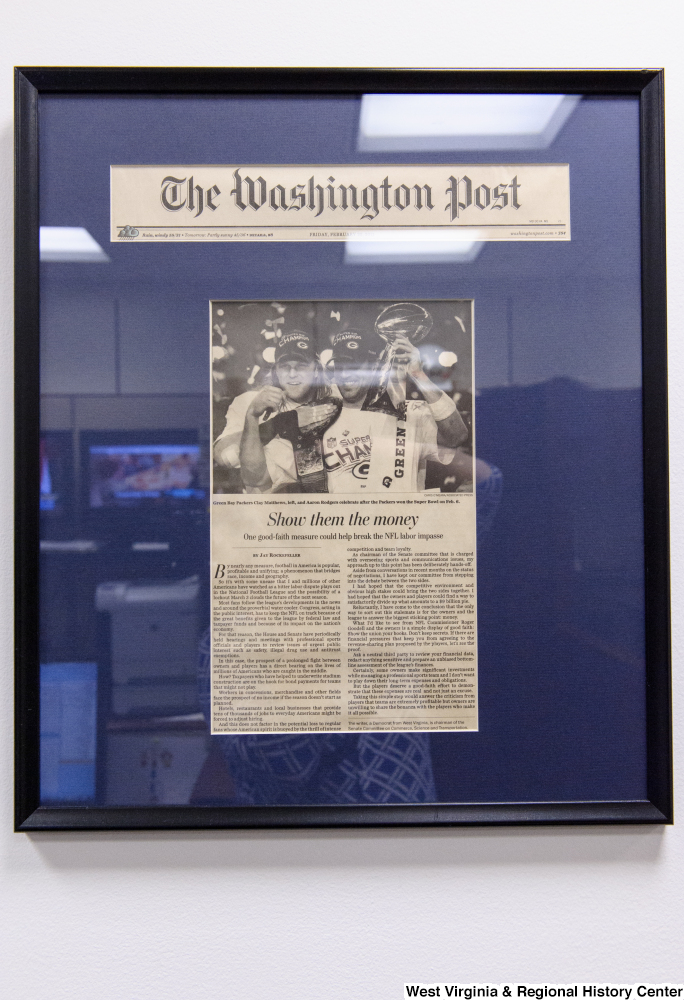 ["A framed Washington Post article titled \"Show them the Money\" hangs in Senator John D. (Jay) Rockefeller's office."]%