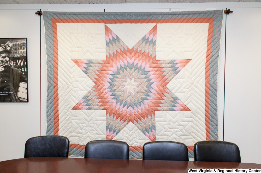 ["A quilt hangs on a wall in Senator John D. (Jay) Rockefeller's office."]%
