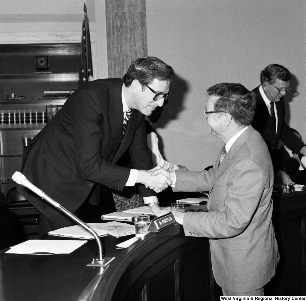 ["Senator John D. (Jay) Rockefeller shakes hands with the Colgan Airways president following a hearing of the Commerce, Science, and Transportation Committee."]%