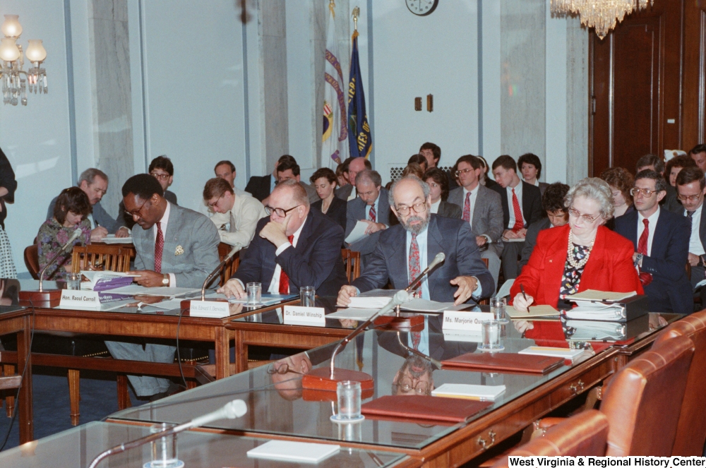 ["This photograph shows invited guests and experts that are attending a conference event in the Senate."]%